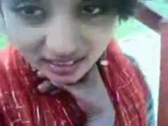 A young girlfriend from Bangladesh shows off her breasts on webcam.